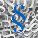 Niebieski symbol paragrafu na tle białych znaków paragrafu